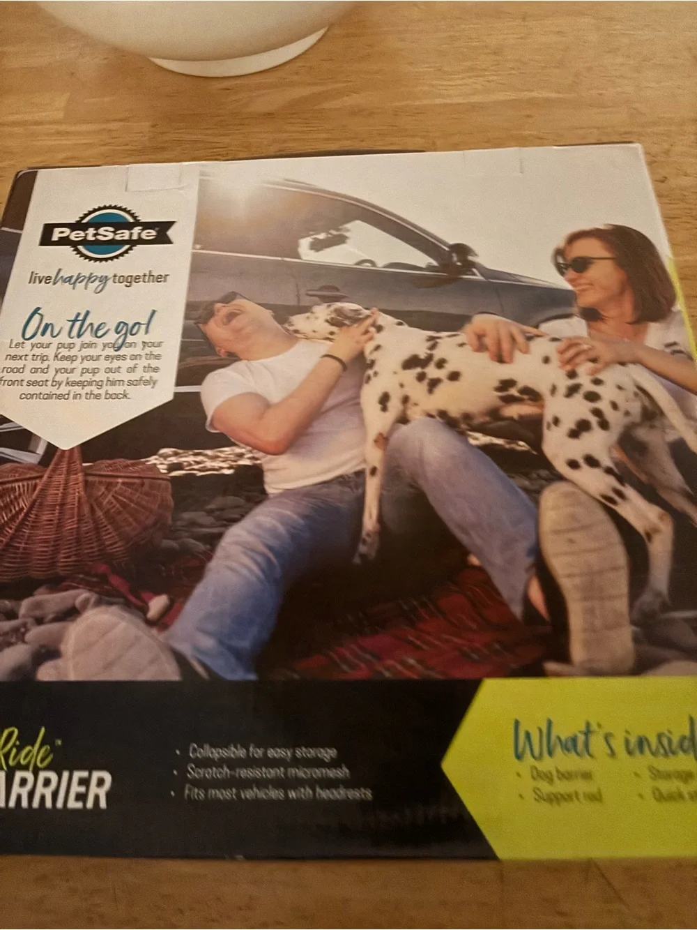 PetSafe Happy Ride Dog Barrier in Green and Blue Packaging